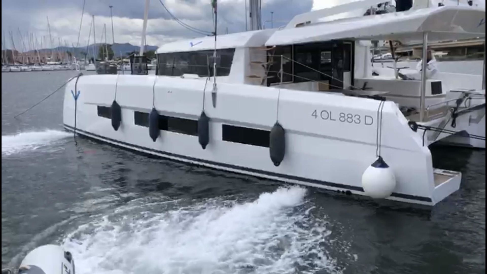 A catamaran showing activated Jet Thruster nozzles at the bow and stern, a clear visual how the water is being expelled from the Jet Thruster nozzles. In this case the Catamaran is being pushed sideway