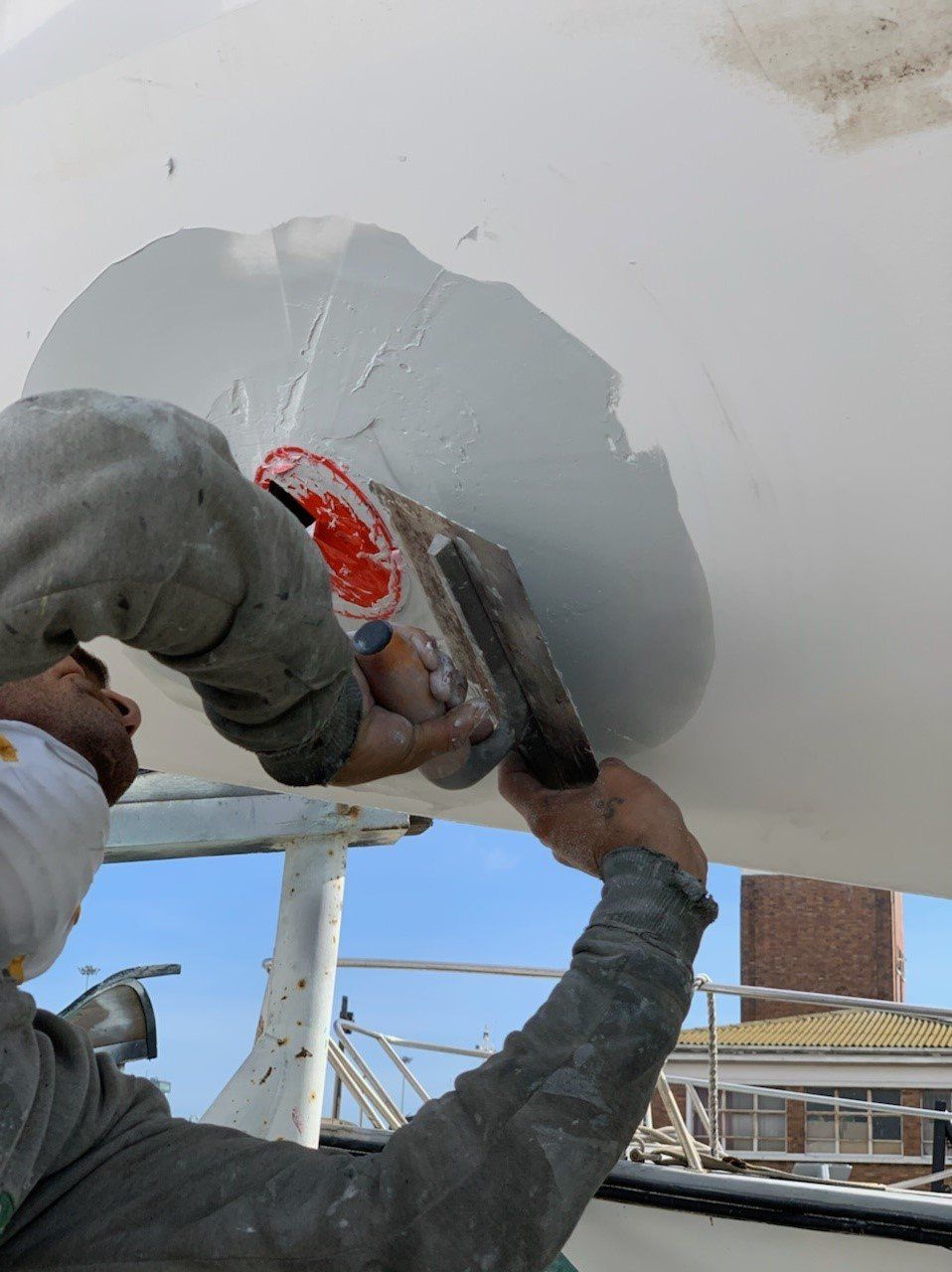 A Jet Thruster technician is preparing a Jet Thruster nozzle with Epoxy for a smooth finishing and integration with the hull