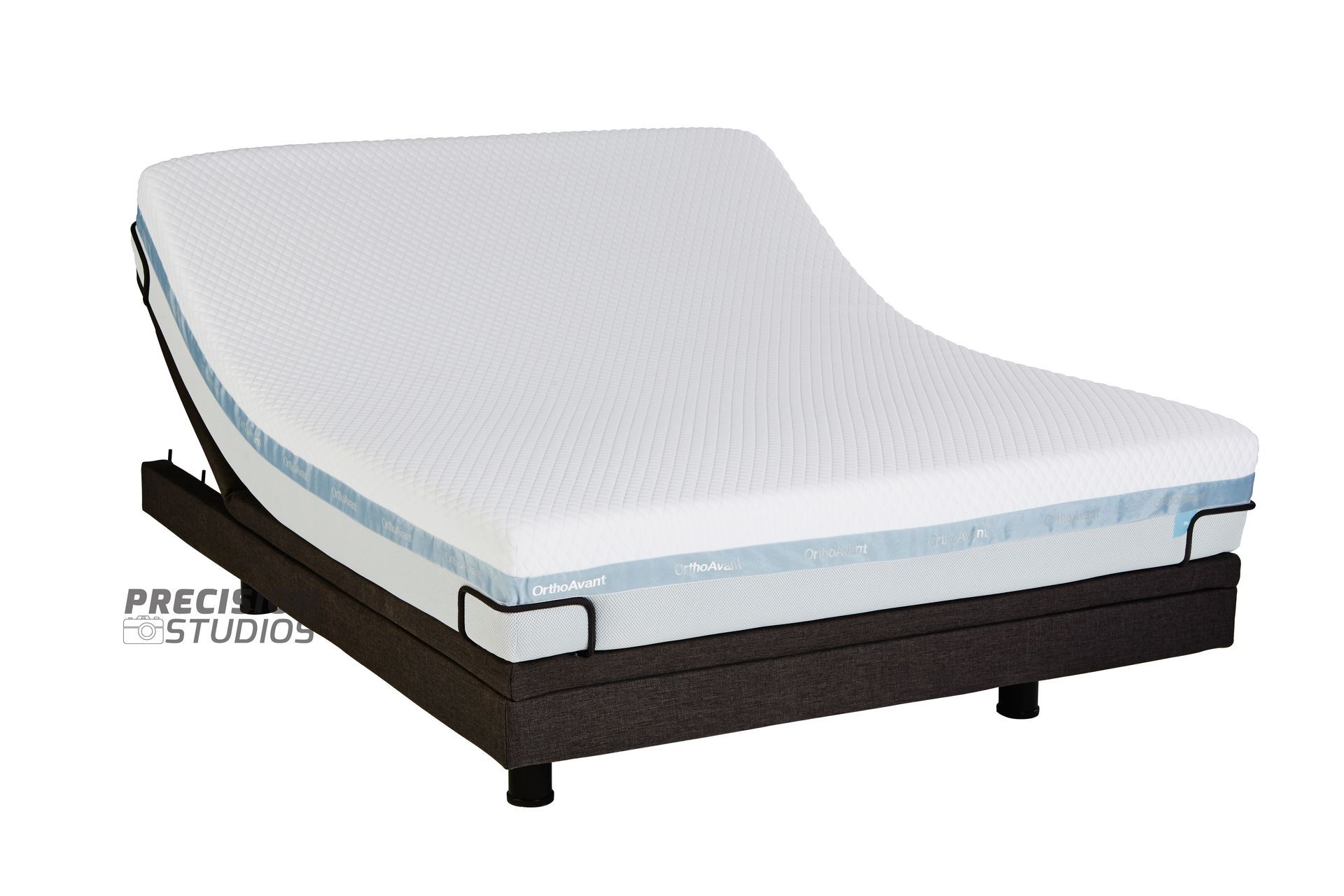 An adjustable bed with a white mattress on it
