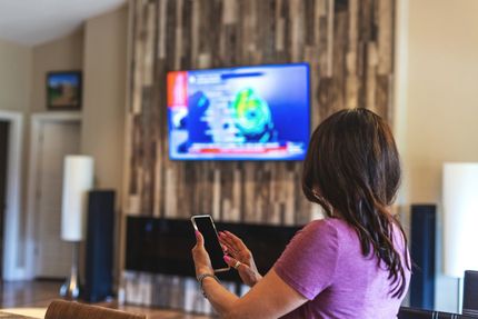 Person Using Mobile Phone To Watch TV | Central Coast, NSW | TVCR Help Person Using Mobile Phone To Watch TV | Central Coast, NSW | TVCR Help