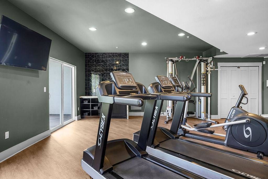 Interior of a resident gym with treadmills and exercise machines at Solaire Luxury Apartments, offering apartments for rent in Albuquerque, NM.