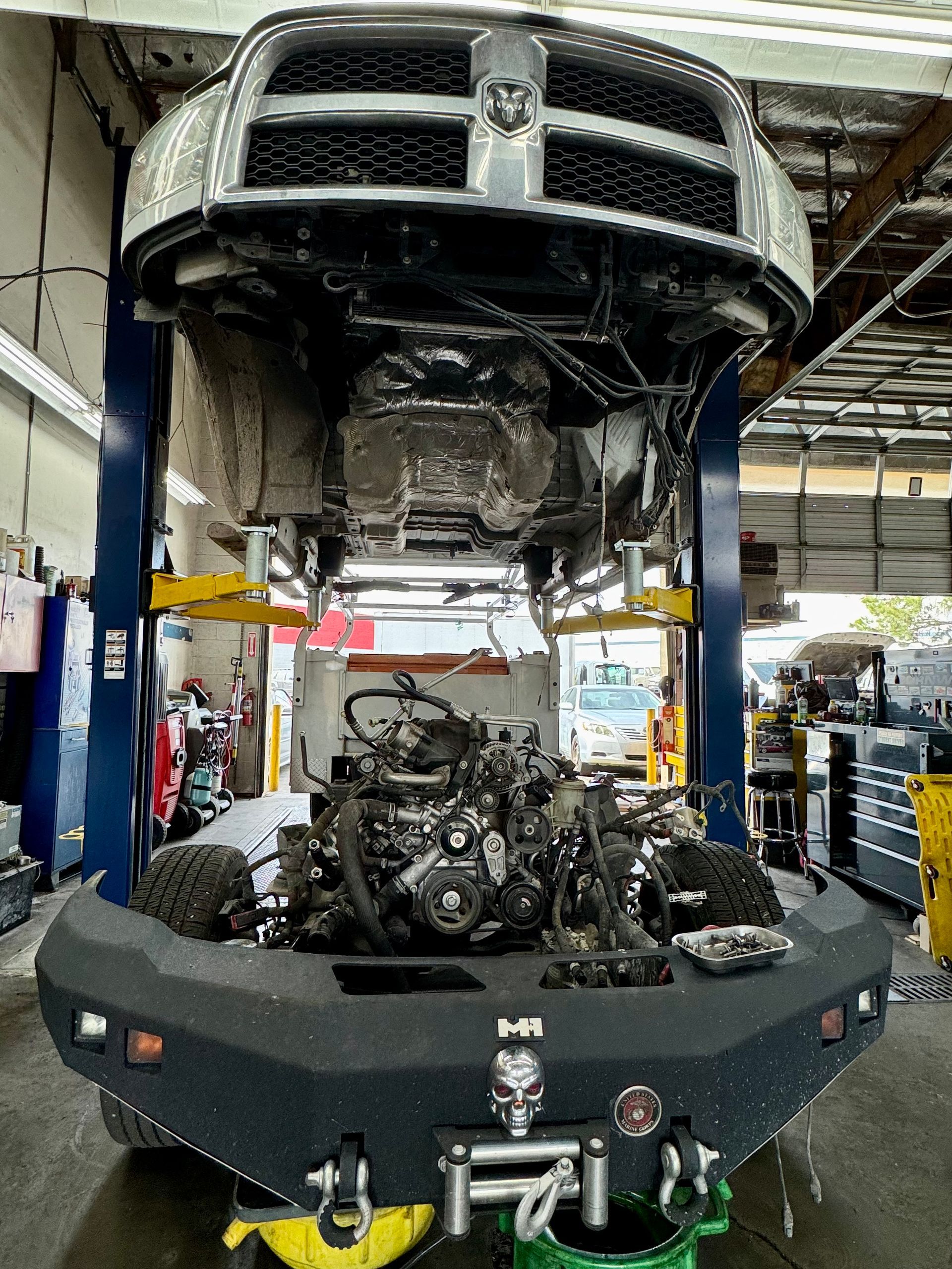 Vehicle Lifted With Engine Removed in Auto Repair Shop | Automotive Specialists LLC