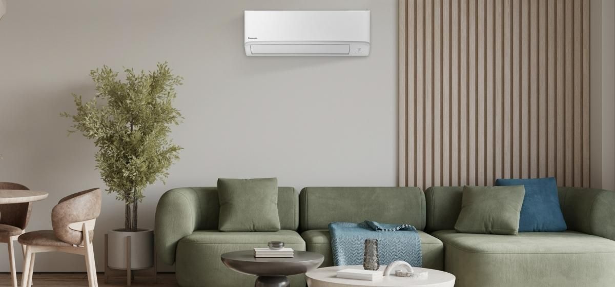A Modern Living Room Features a Panasonic Air Conditioner — Sunworks Eco Plumbing In Torquay, VIC