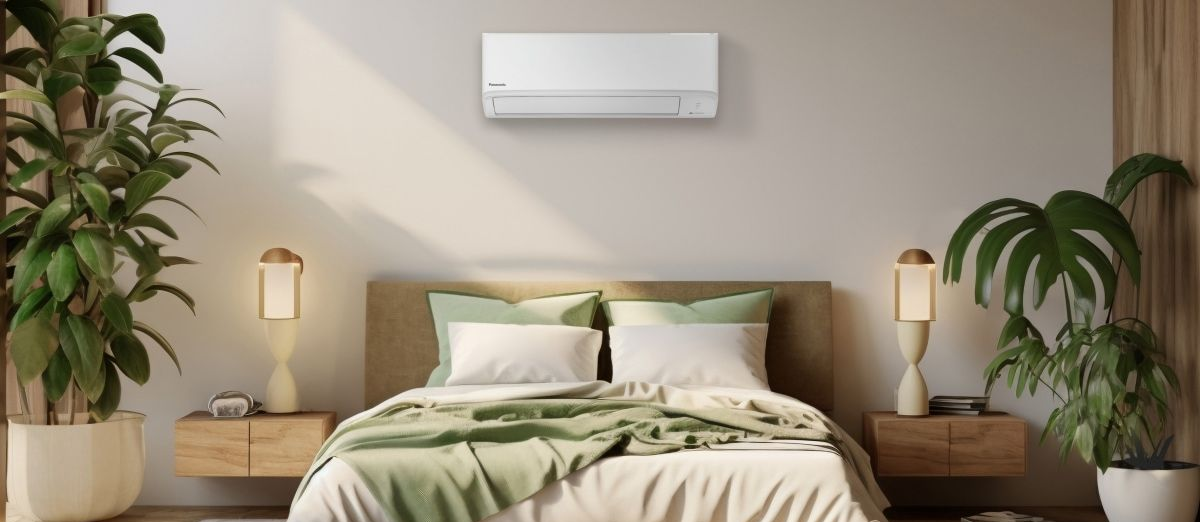 A Modern, Minimalist Bedroom With a Bed Featuring Light Green Bedding — Sunworks Eco Plumbing In Altona, VIC