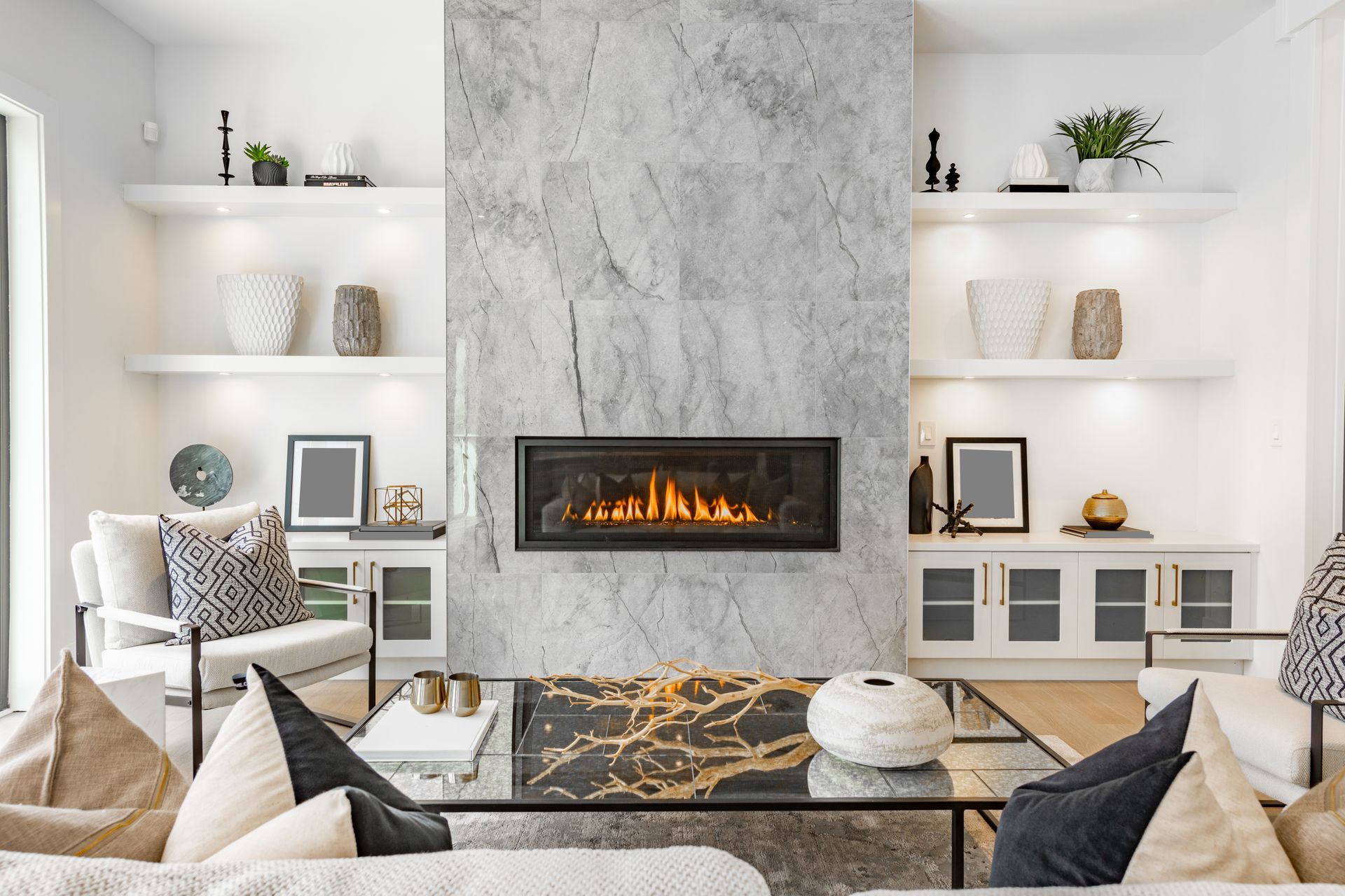A fireplace with a basket of wood in front of it in a living room.
