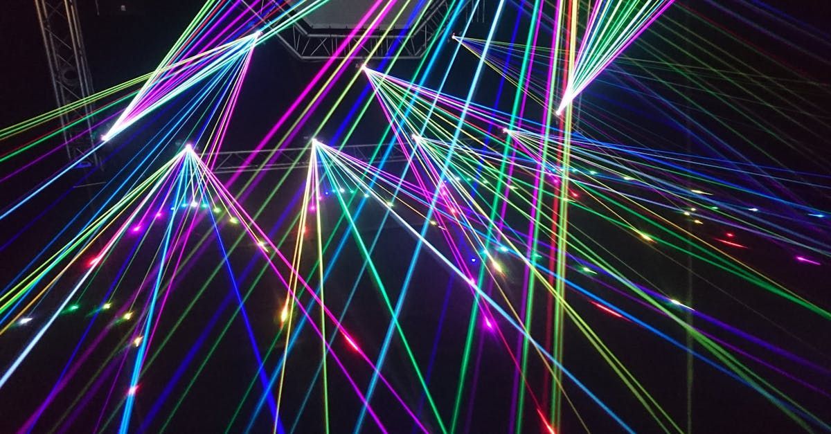 A bunch of colorful lights are shining on a black background.