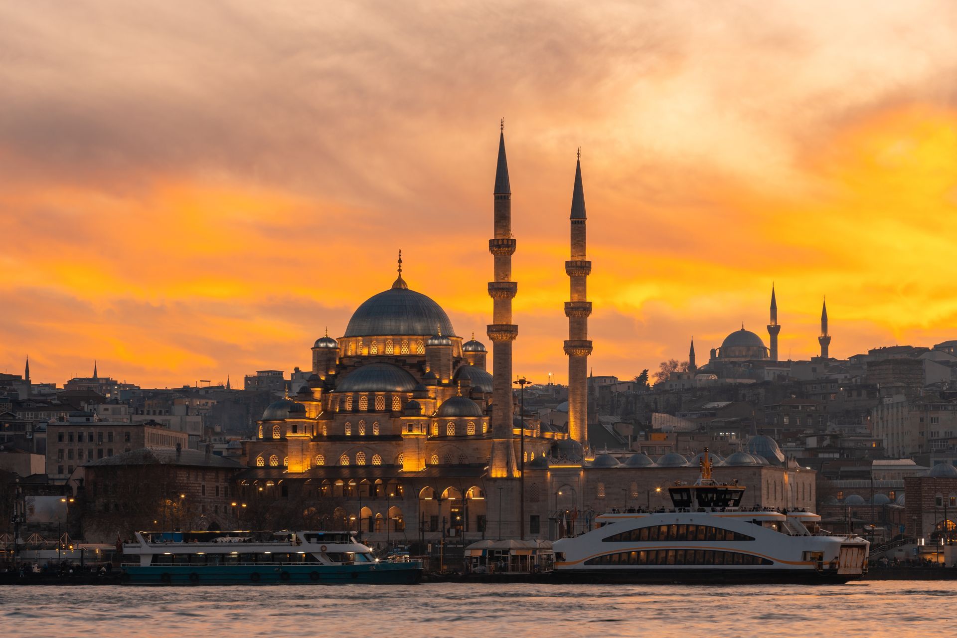 Istanbul skyline at sunset with the Blue Mosque and silhouetted minarets over the water