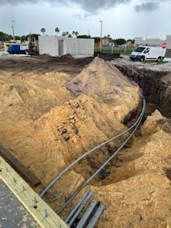 A large pile of dirt is sitting in the middle of a construction site.