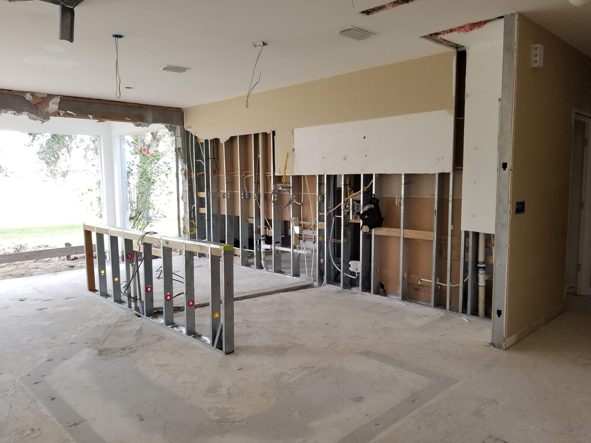 An empty room with a ladder in the middle of it