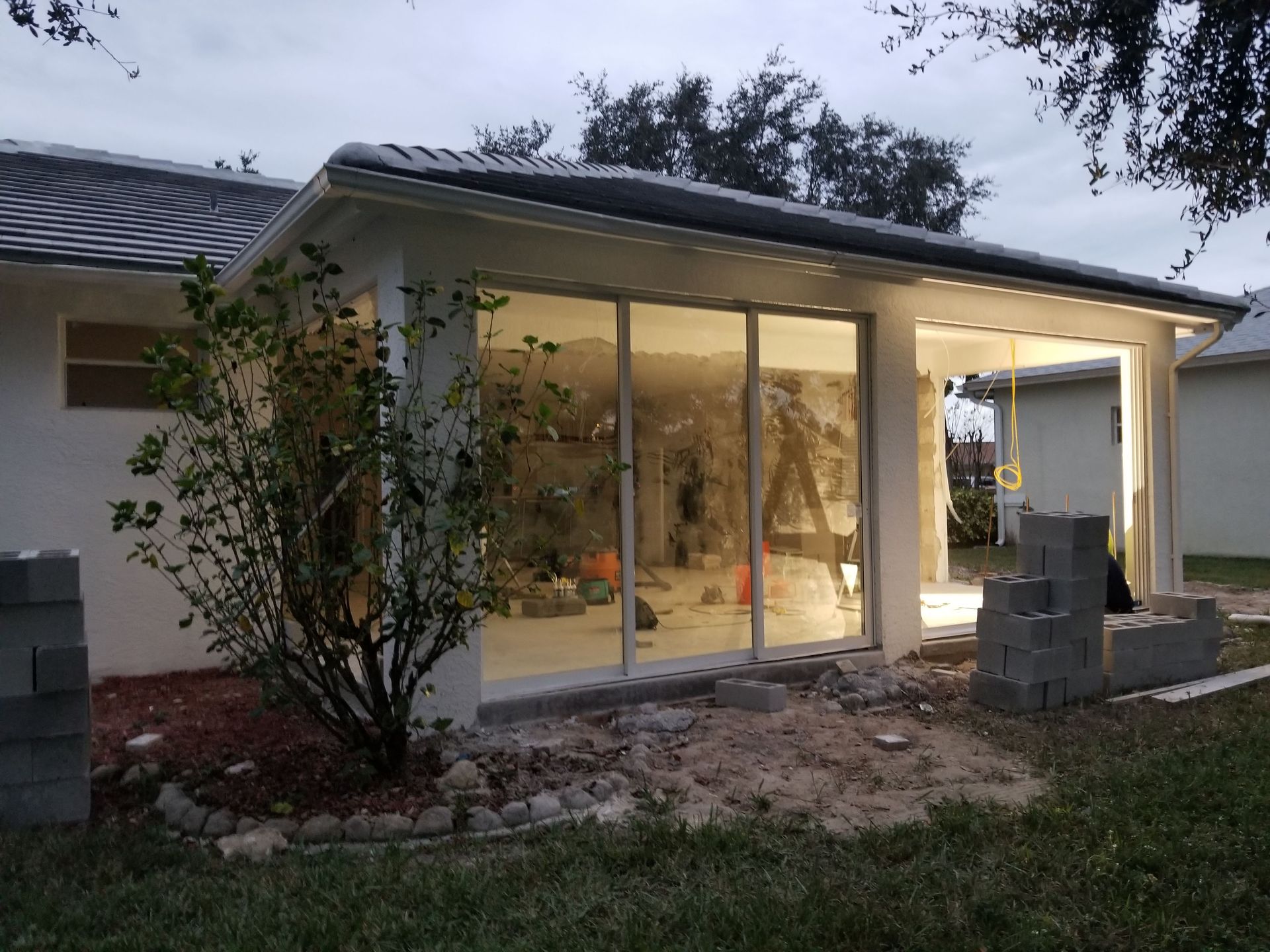 A house that is being remodeled with sliding glass doors