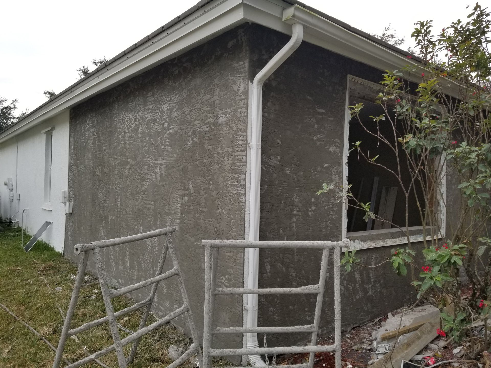 A house with a gutter on the side of it