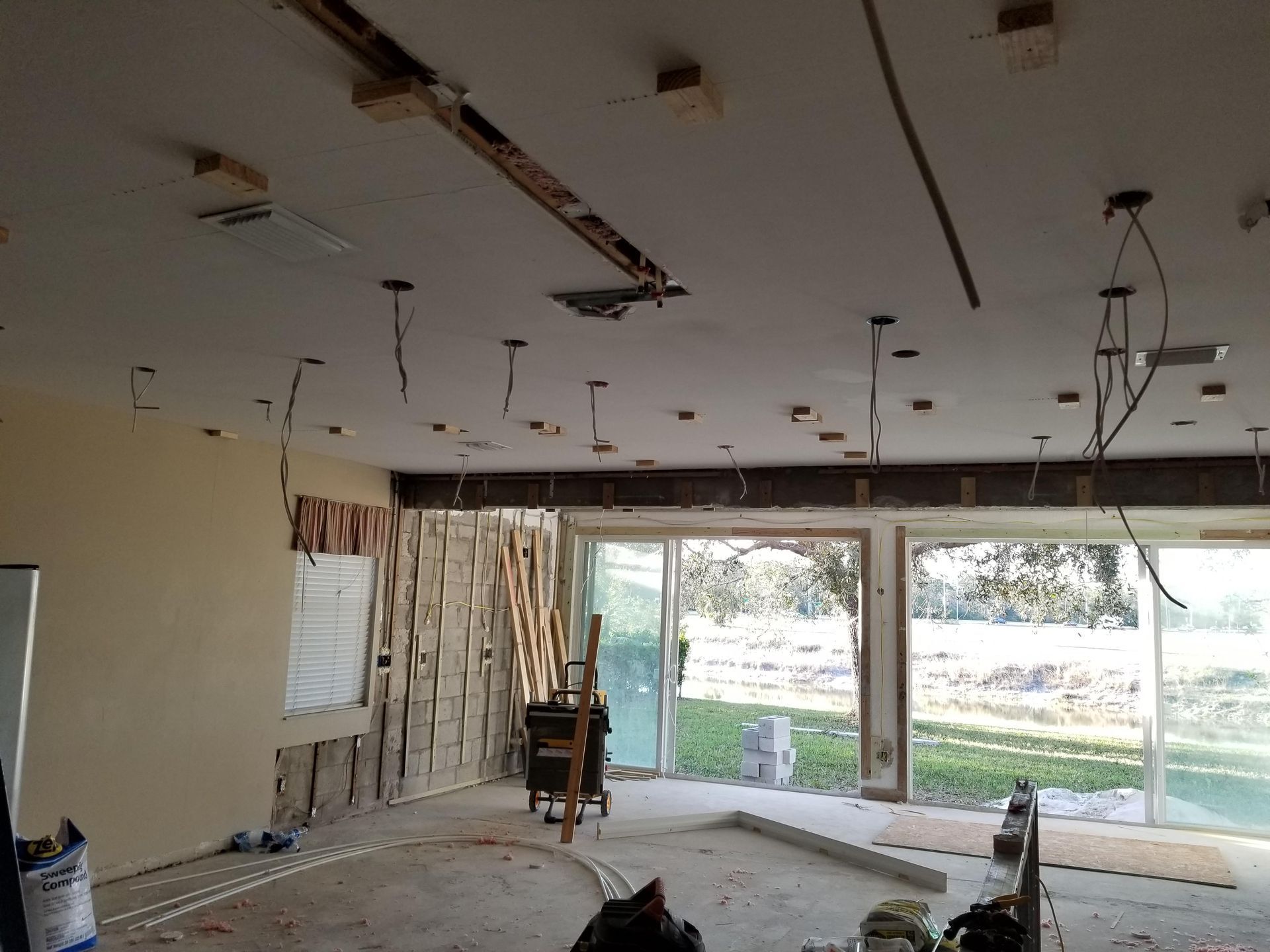 A room with a lot of wires hanging from the ceiling