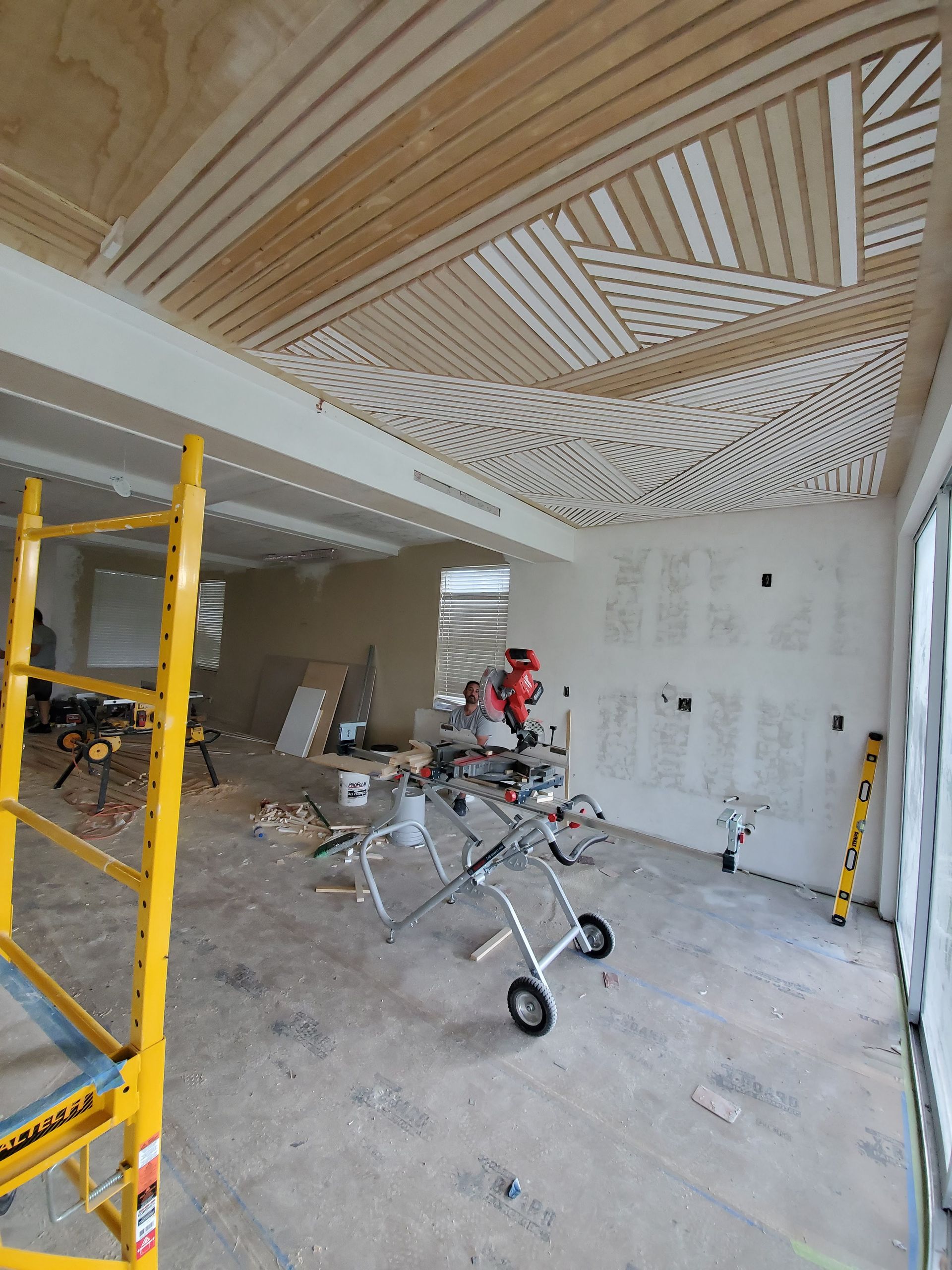 A room with a ceiling that has a geometric pattern on it