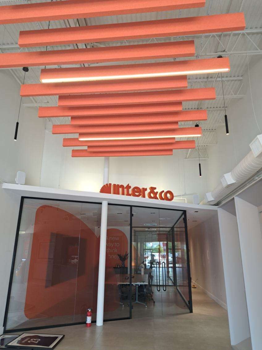 A hallway with a sign that says enter & co