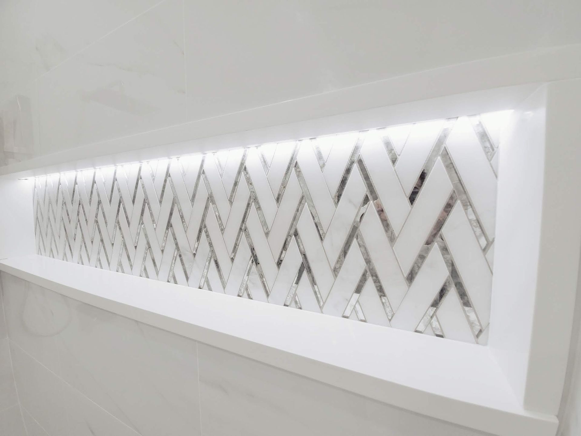 A white wall with a chevron pattern on it
