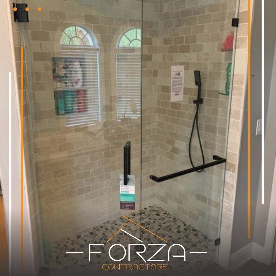A picture of a shower with forza contractors written on it