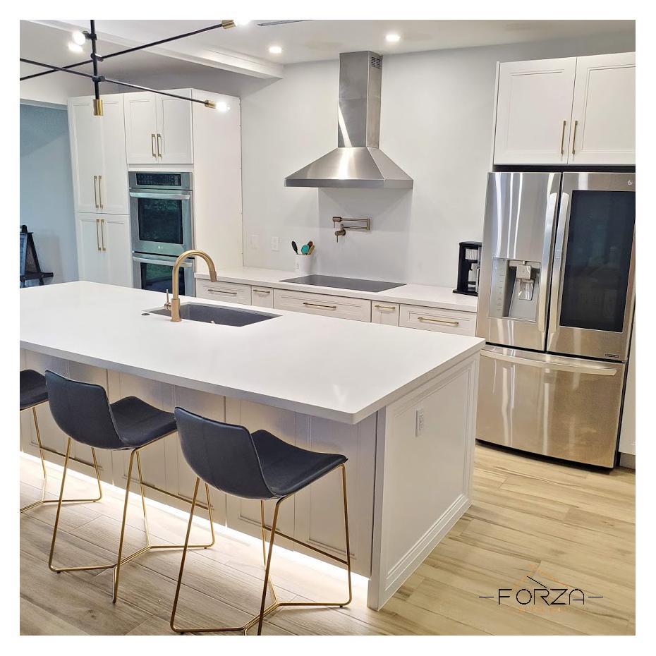 A kitchen with white cabinets and stainless steel appliances