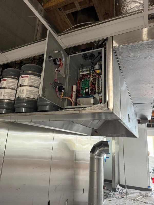A ceiling mounted box with a lot of wires coming out of it.