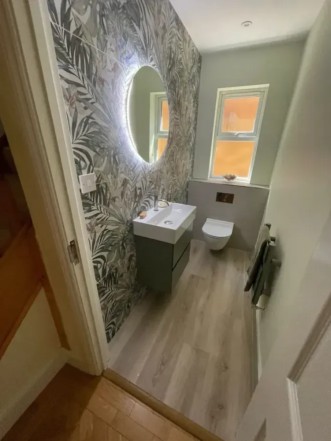 Cloakroom bathroom with LED mirror designed and fitted by Options Bath and Tile Studio Ascot, Berkshire.