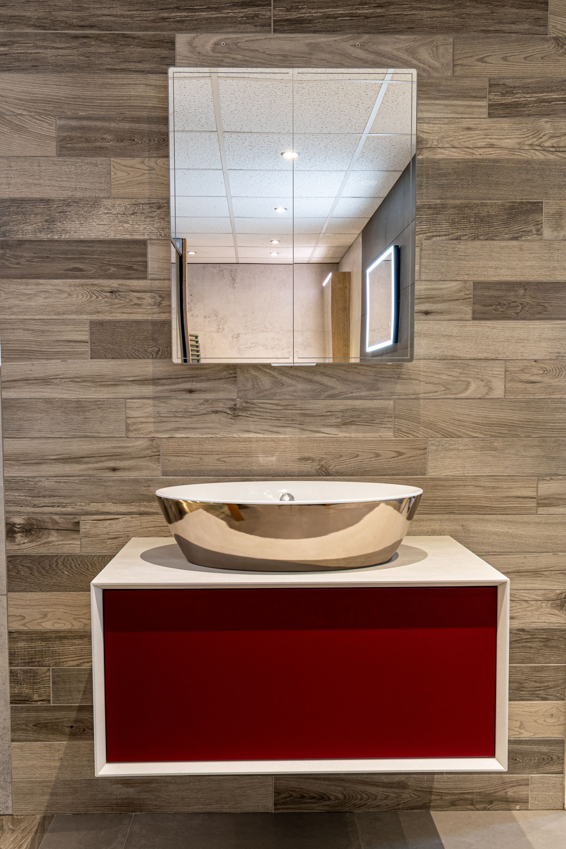 Close-up view of a mirror-finished countertop basin showcasing its sleek and reflective surface for a modern bathroom design