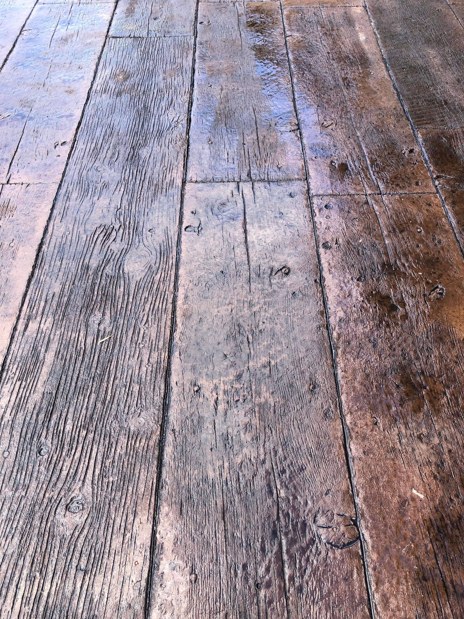 Weathered wooden planks with peeling paint and worn textures in muted gray and brown tones