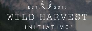 Wild Harvest Initiative logo with white text and a leaf emblem on a dark background