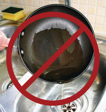 A frying pan's greases is being poured into a sink with a red circle around it