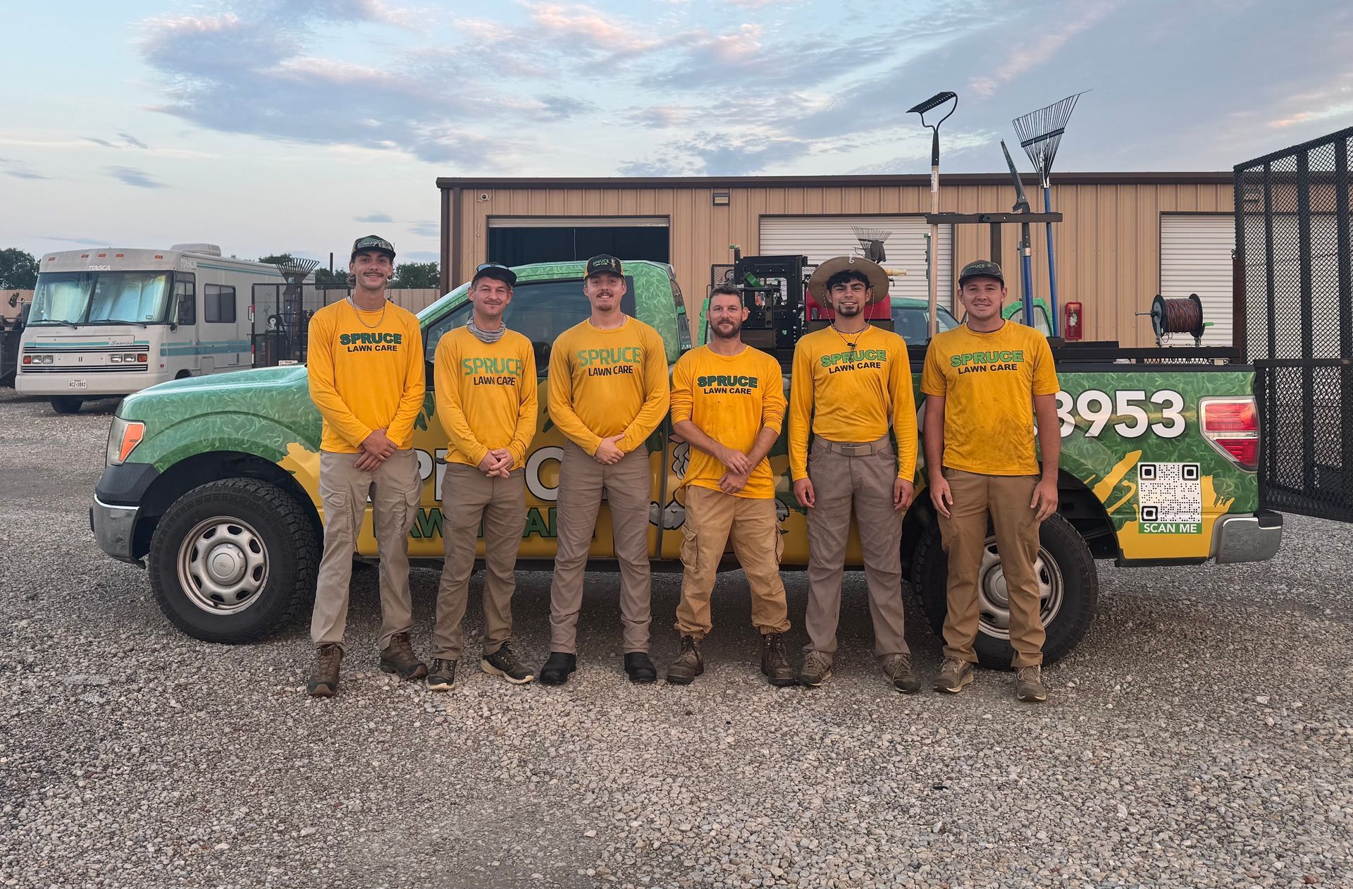 Seven people wearing yellow shirts.