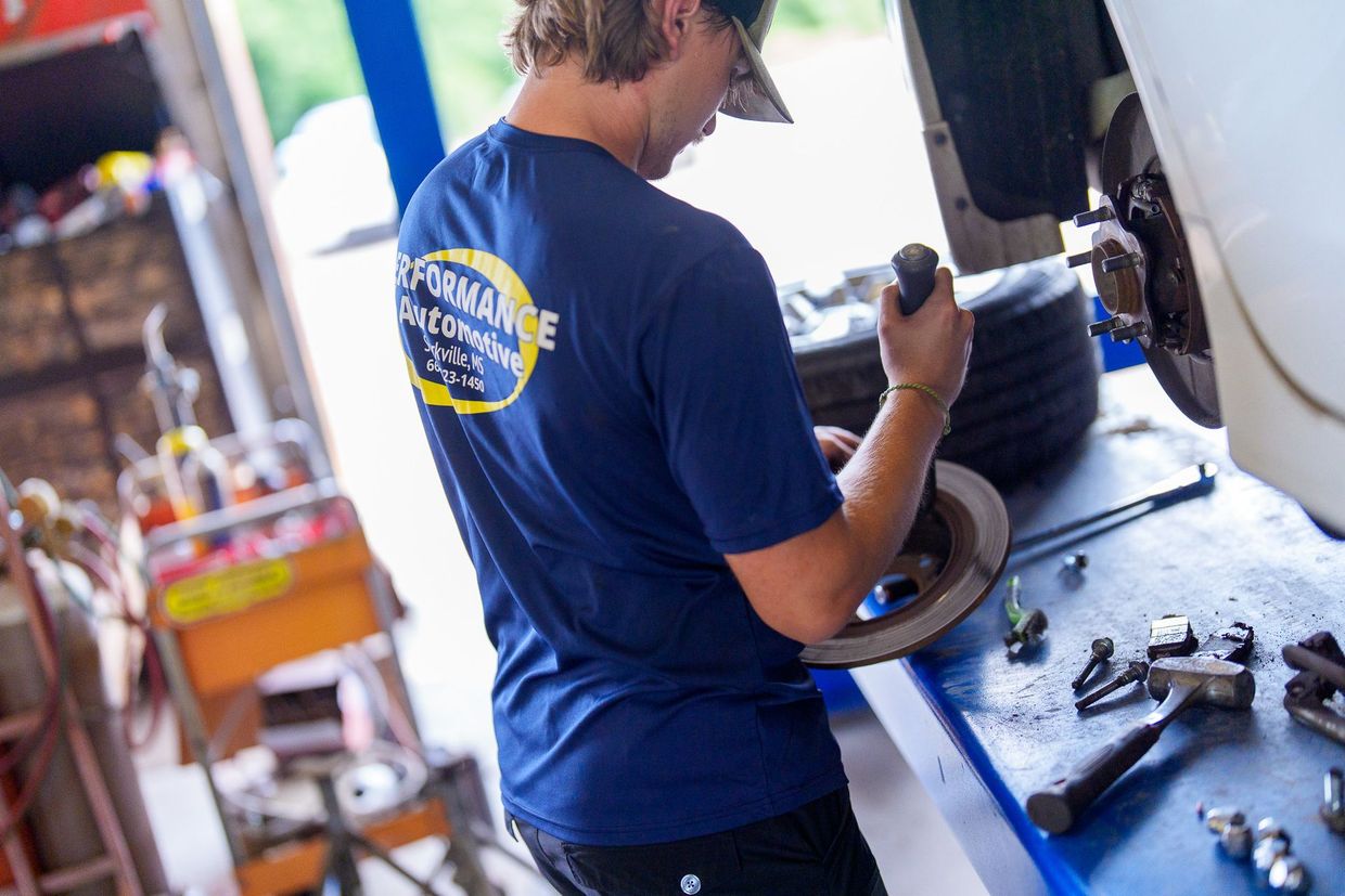 Performance Automotive owner and team in the shop bay