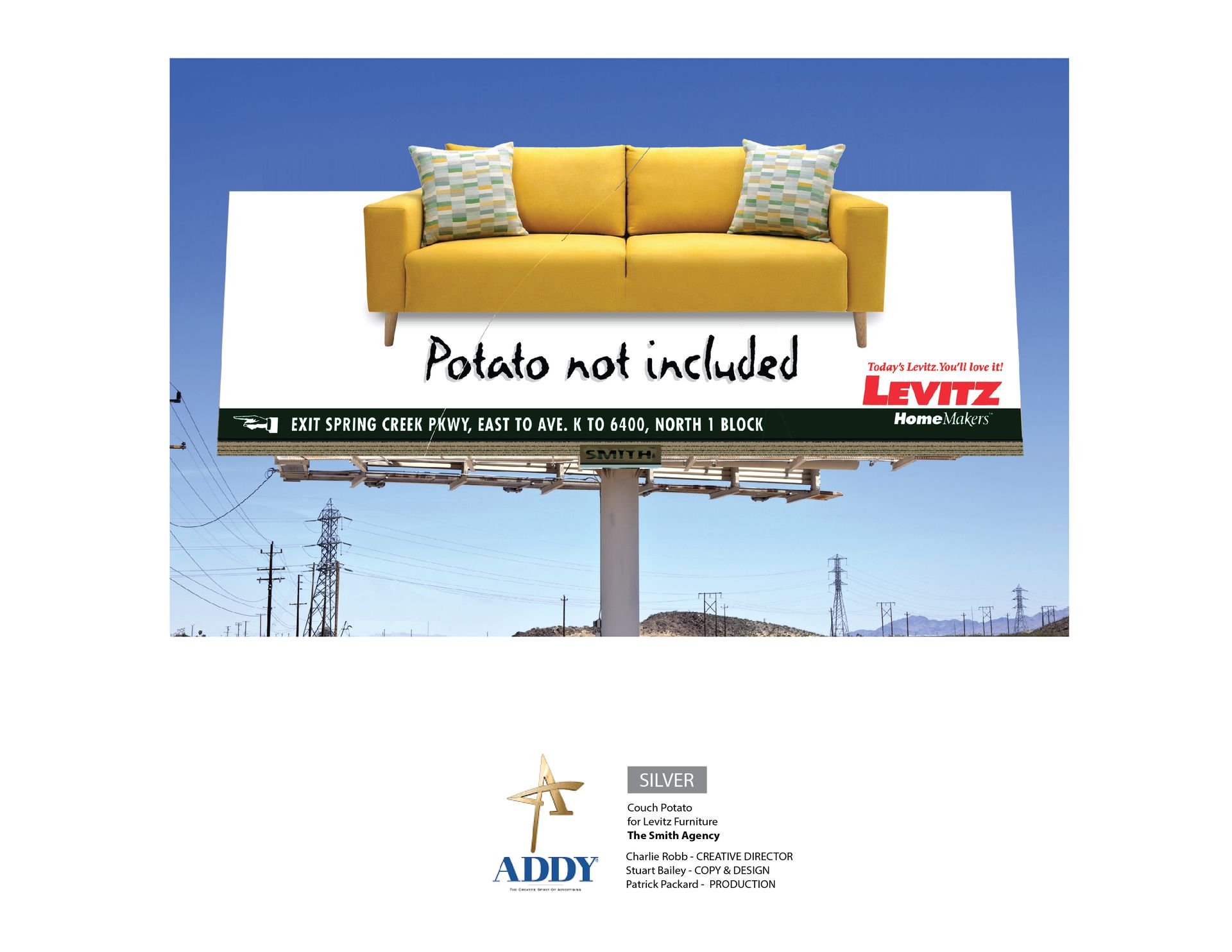 An Addy Award winning billboard with a yellow couch on it that says potato not included.