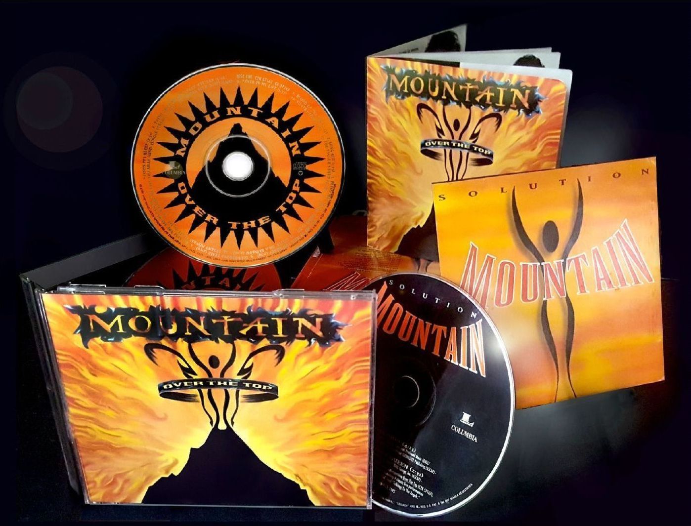A cd called mountain sits on a table
