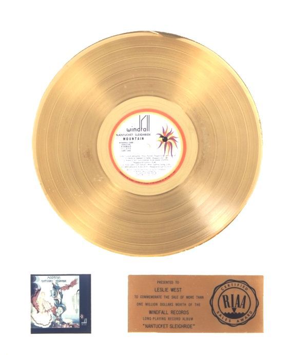 Rock Group Mountains gold record with a picture of a spider on it