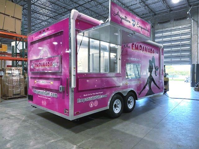Trailer wrap graphics on a large food truck big pink logo for Empanada Girl Sarasota Designs