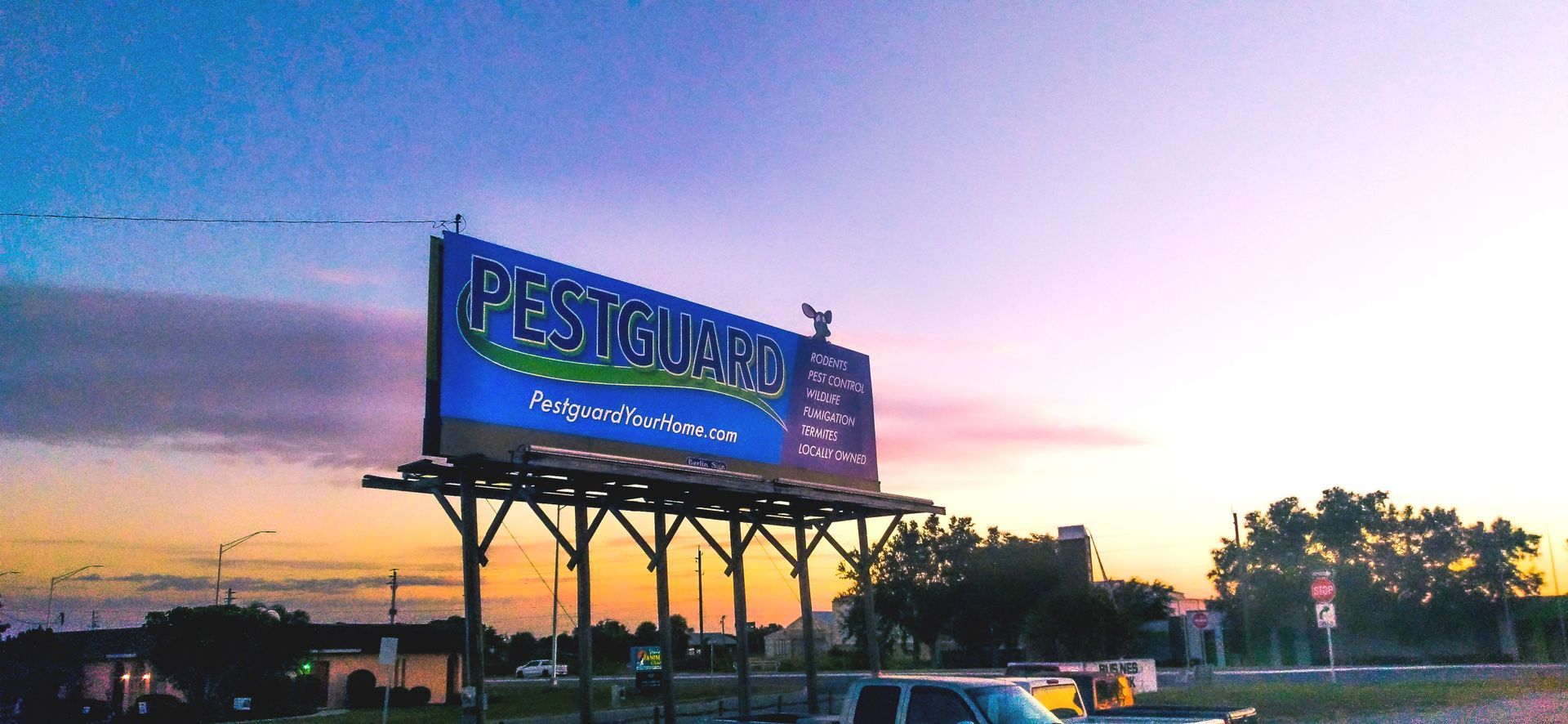 A large billboard with the word pesticide on it