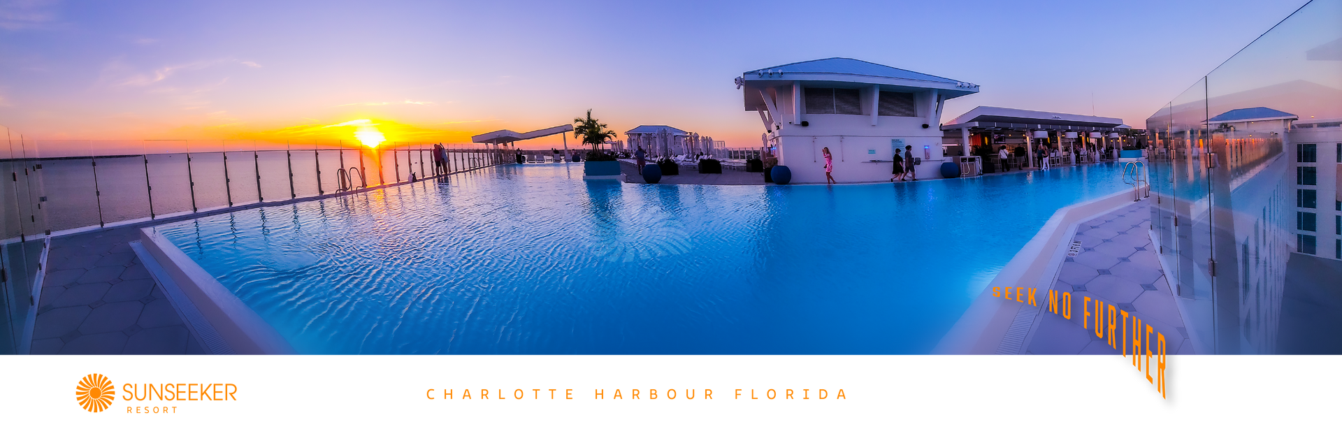 Rooftop pool at sunset, with a white structure, clear water, and a vibrant orange sky.