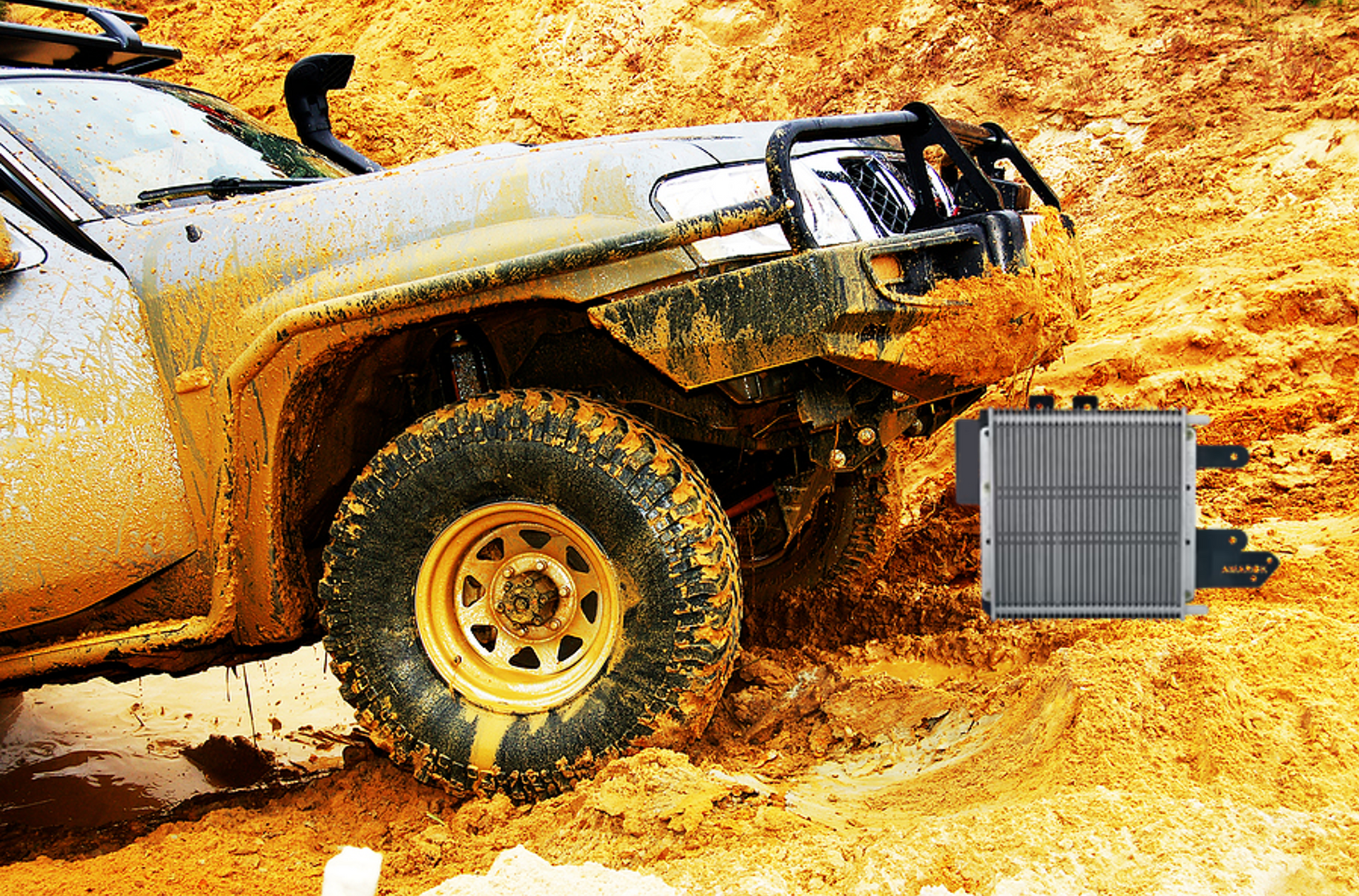 A muddy jeep is driving through the mud next to a radiator.