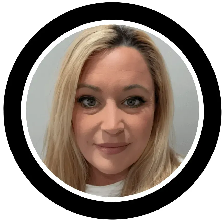 A woman with blonde hair is smiling in a black circle.