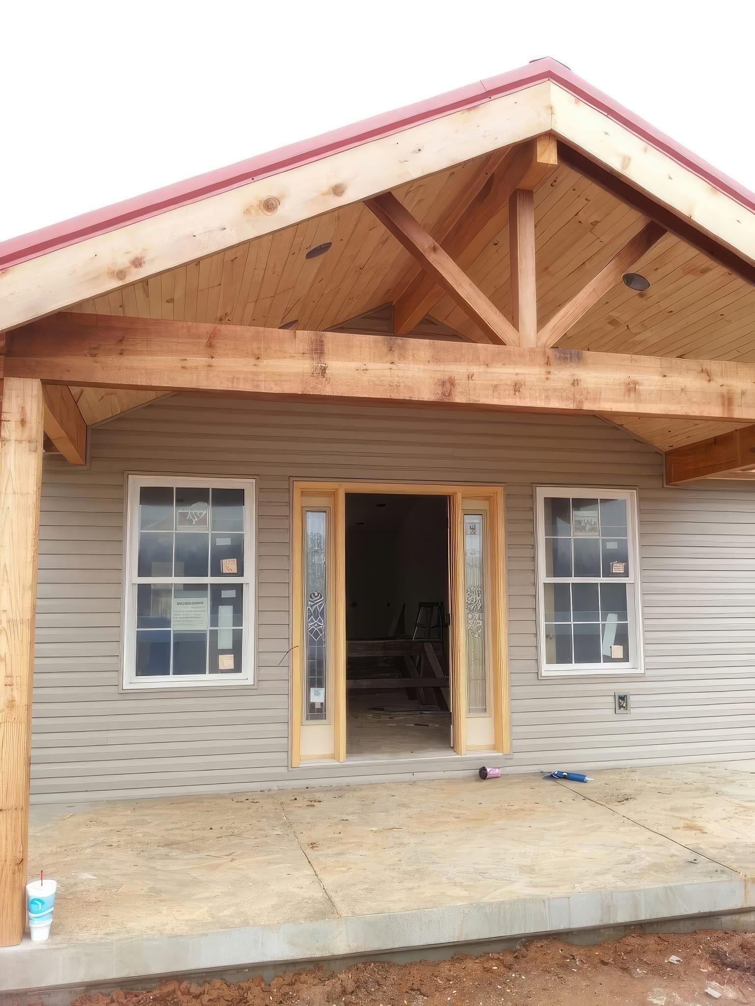 A house under construction with a wooden roof