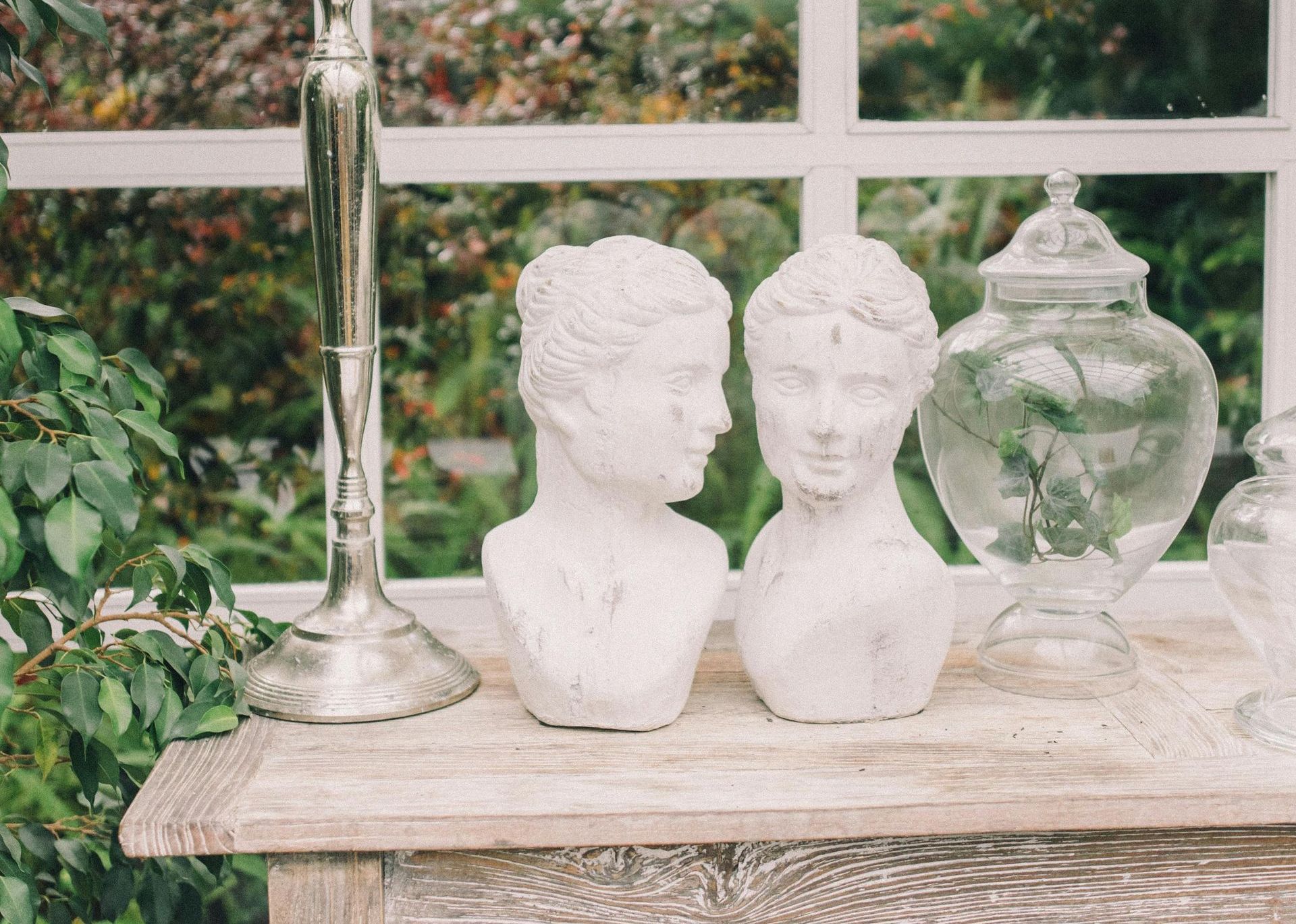A table with a statue of a man and a woman on it