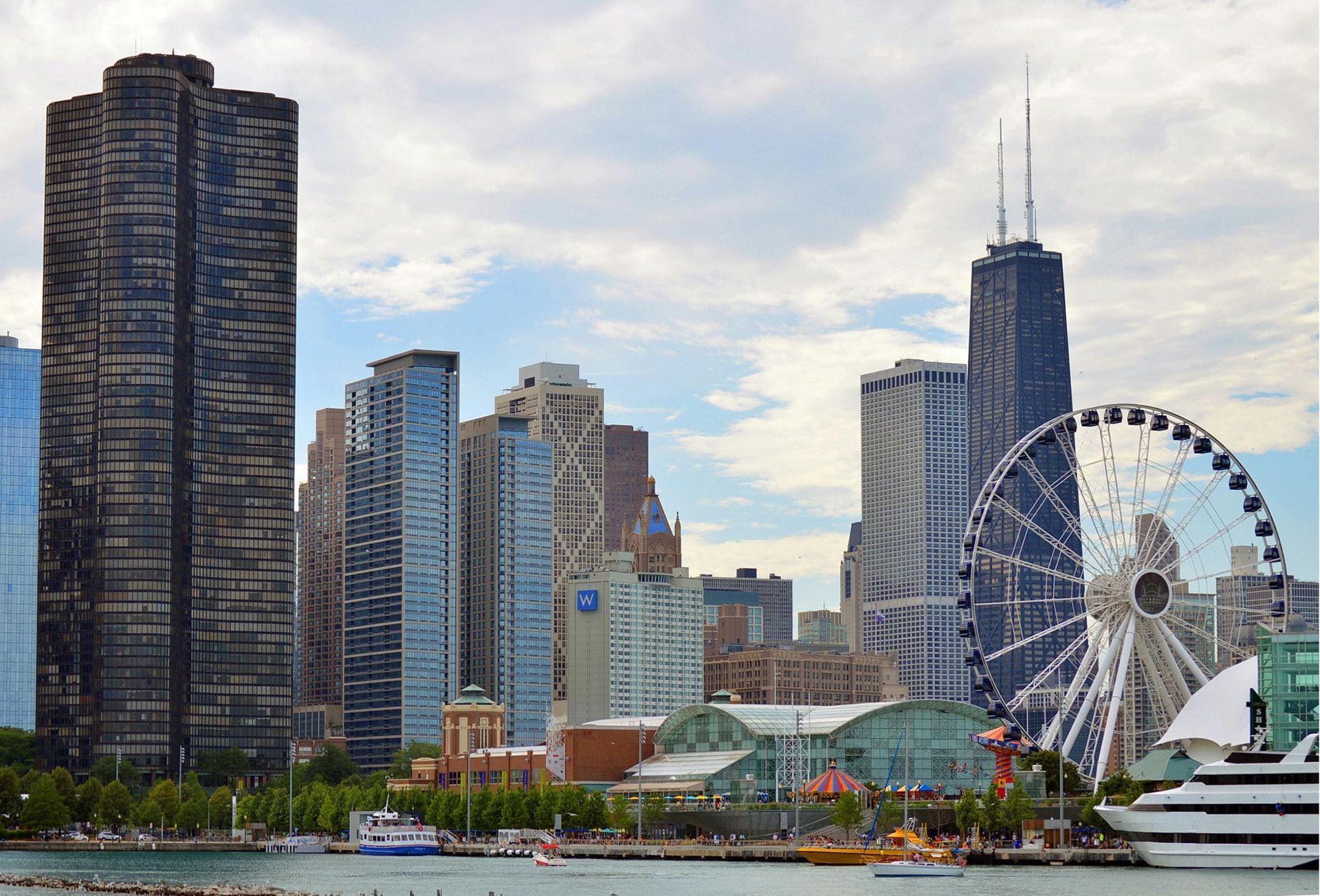 Chicago skyline viewed from the lakefront, showing Navy Pier and surrounding historic and modern buildings.