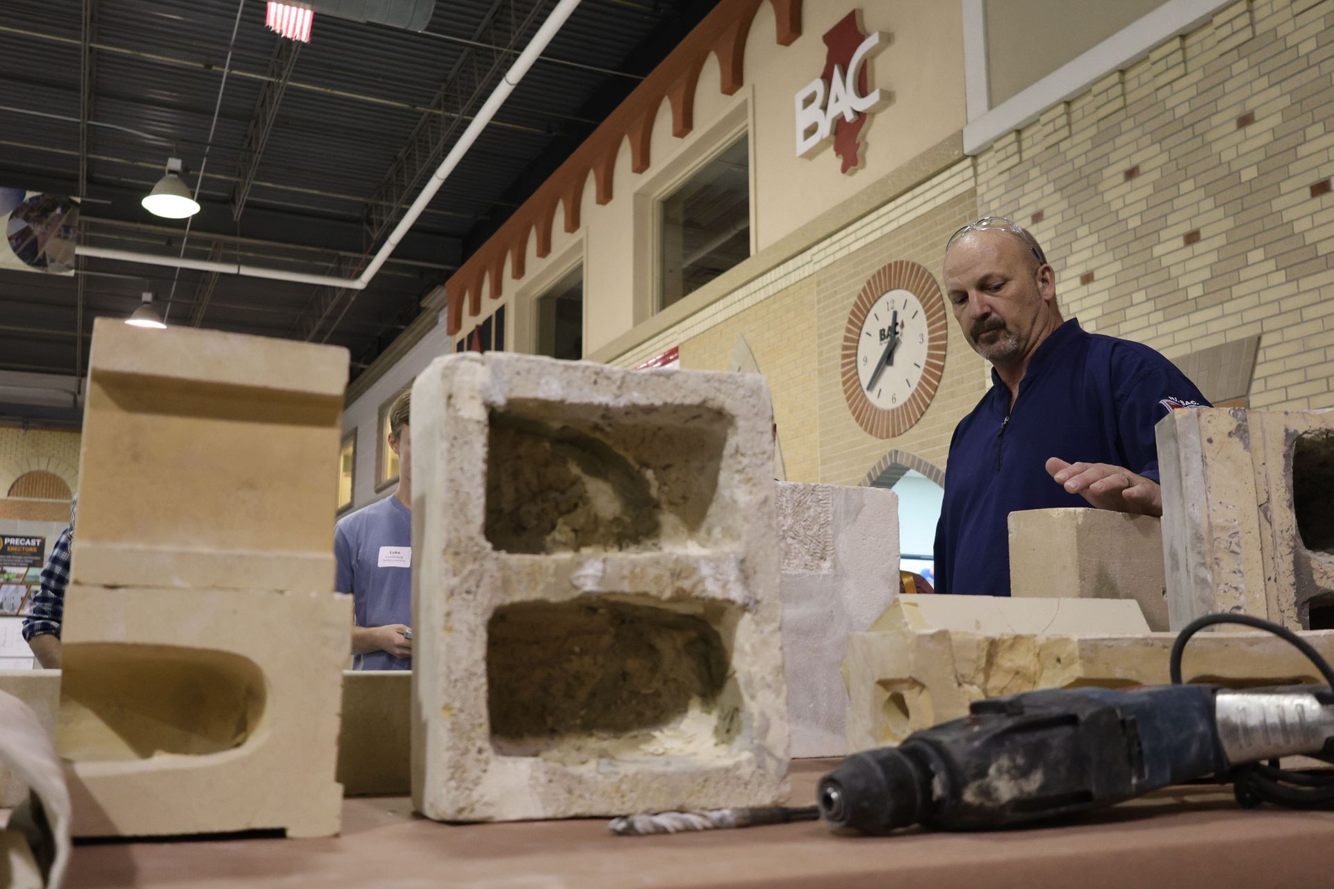 A man is demonstrating best practices for restoring historic building