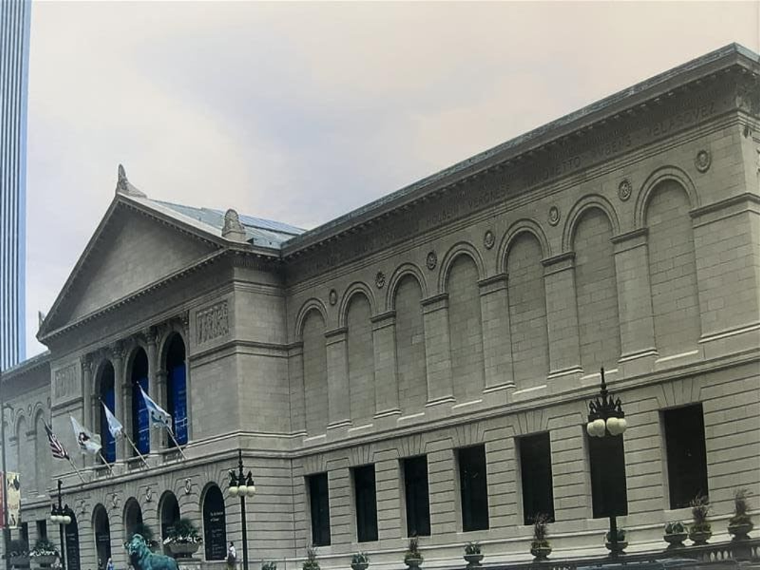 The Art Institute of Chicago’s limestone facade, featuring its iconic arched windows and classical pediment.