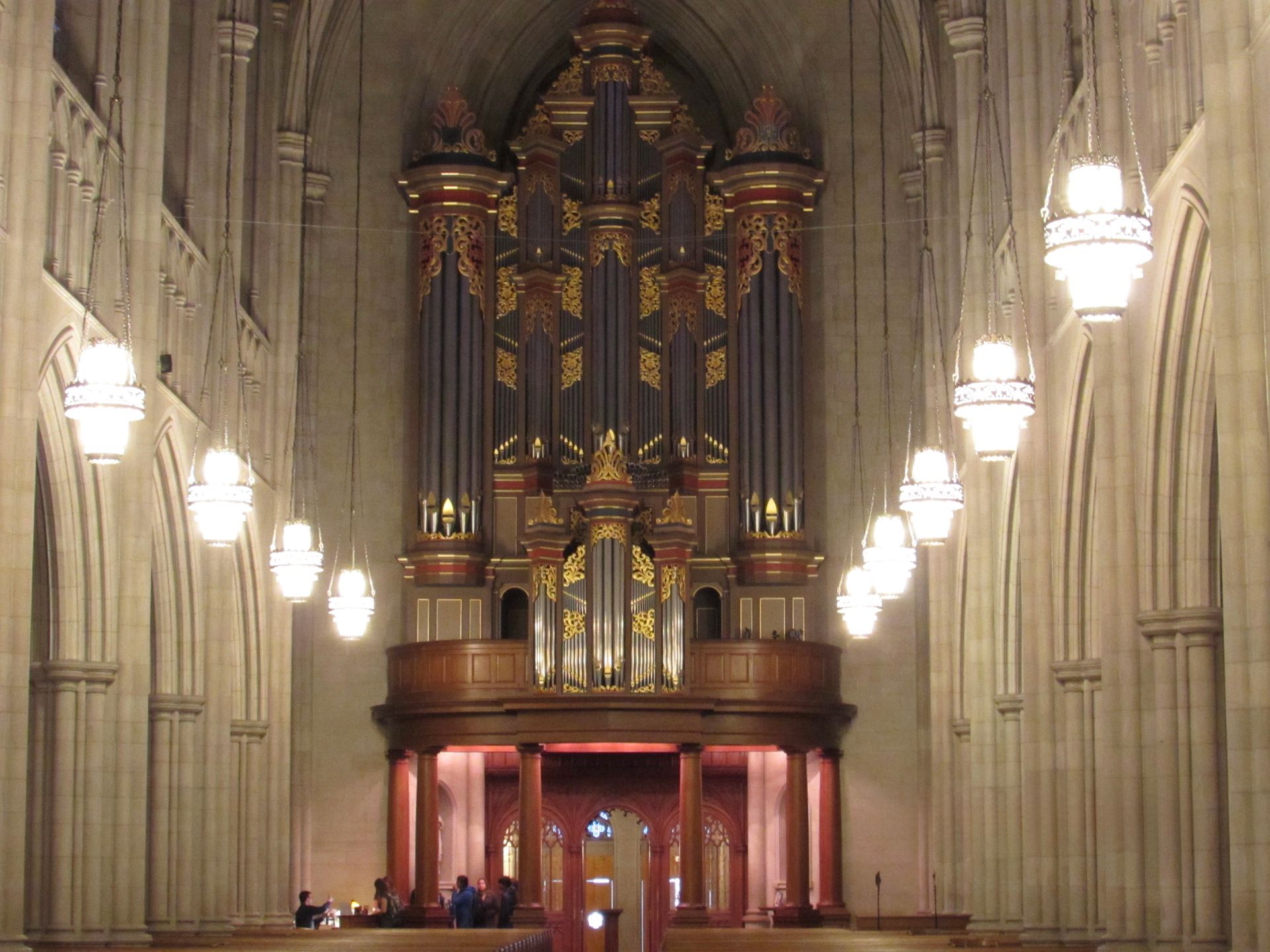 The inside of Duke University's Chapel with a large organ in the middle