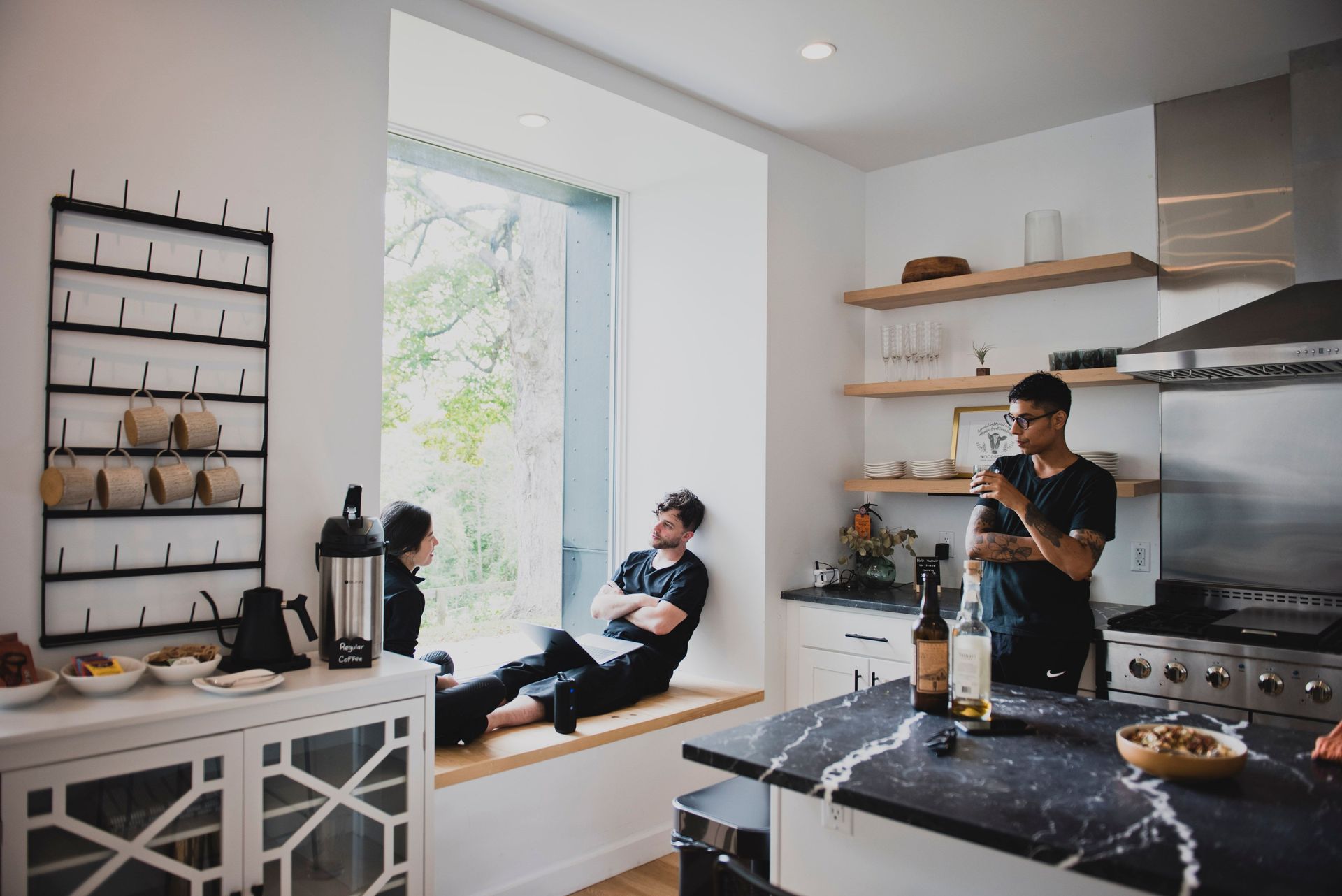 Guests in kitchen during a full rental