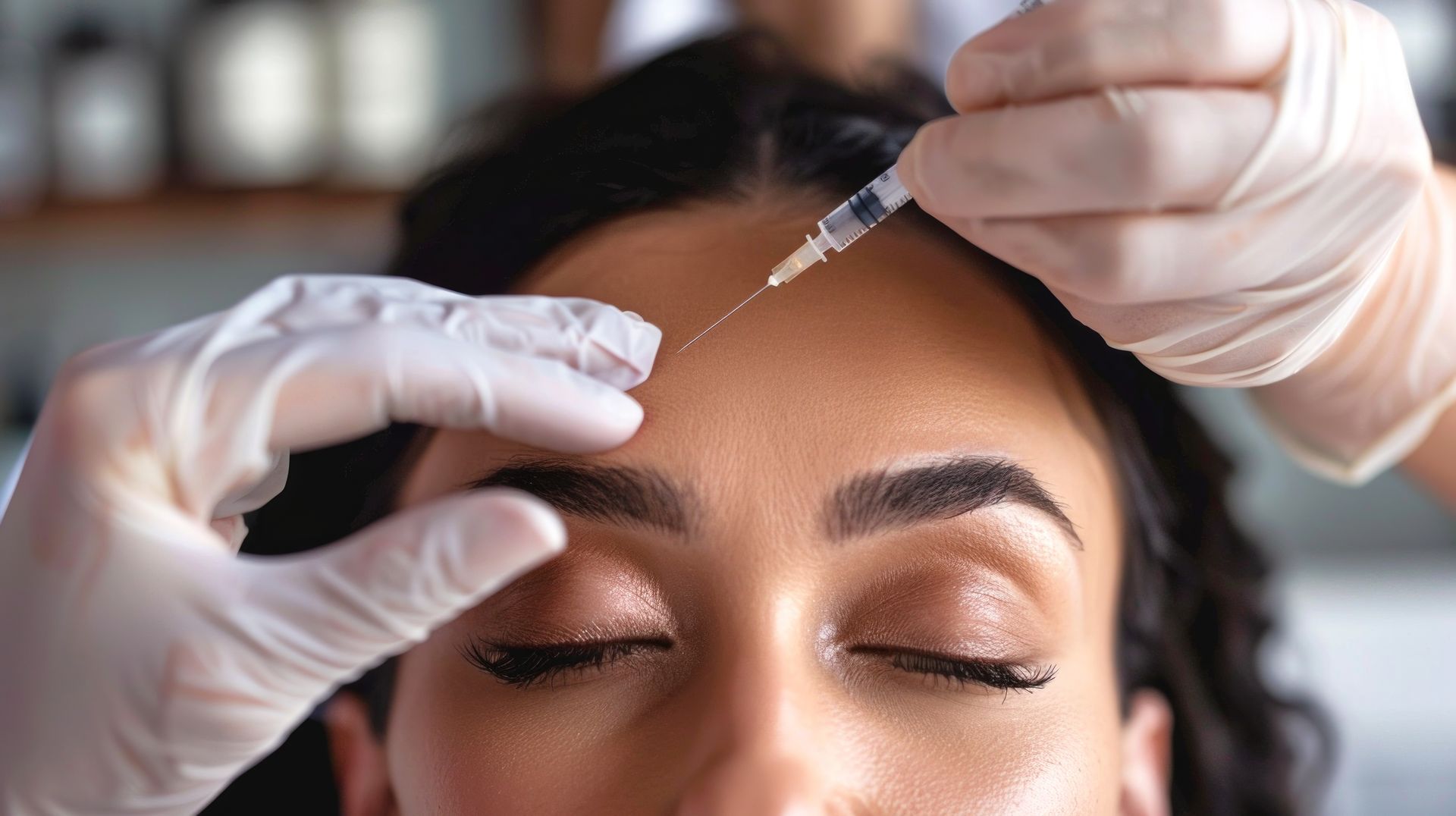 Provider injecting a neurotoxin treatment into a patient's forehead at REJUV Medical in San Francisc