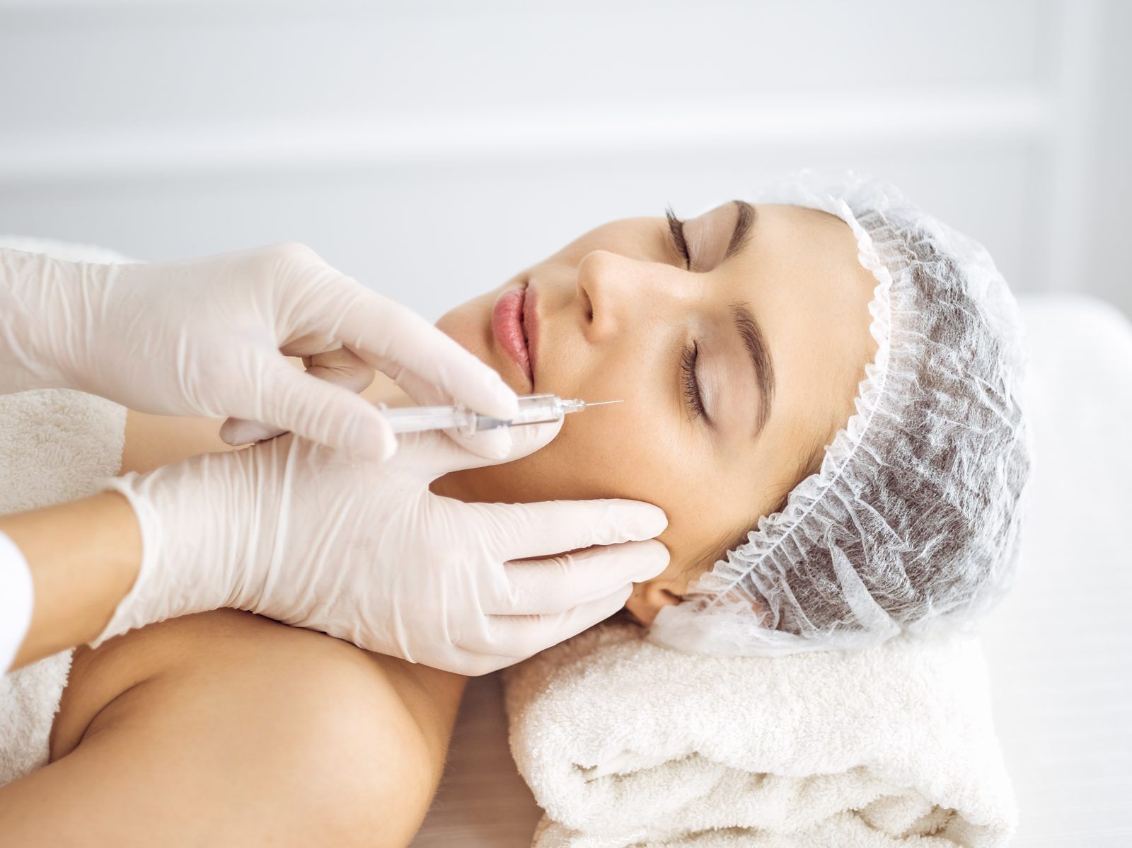Relaxed patient receiving a gentle Rejuran skin booster treatment