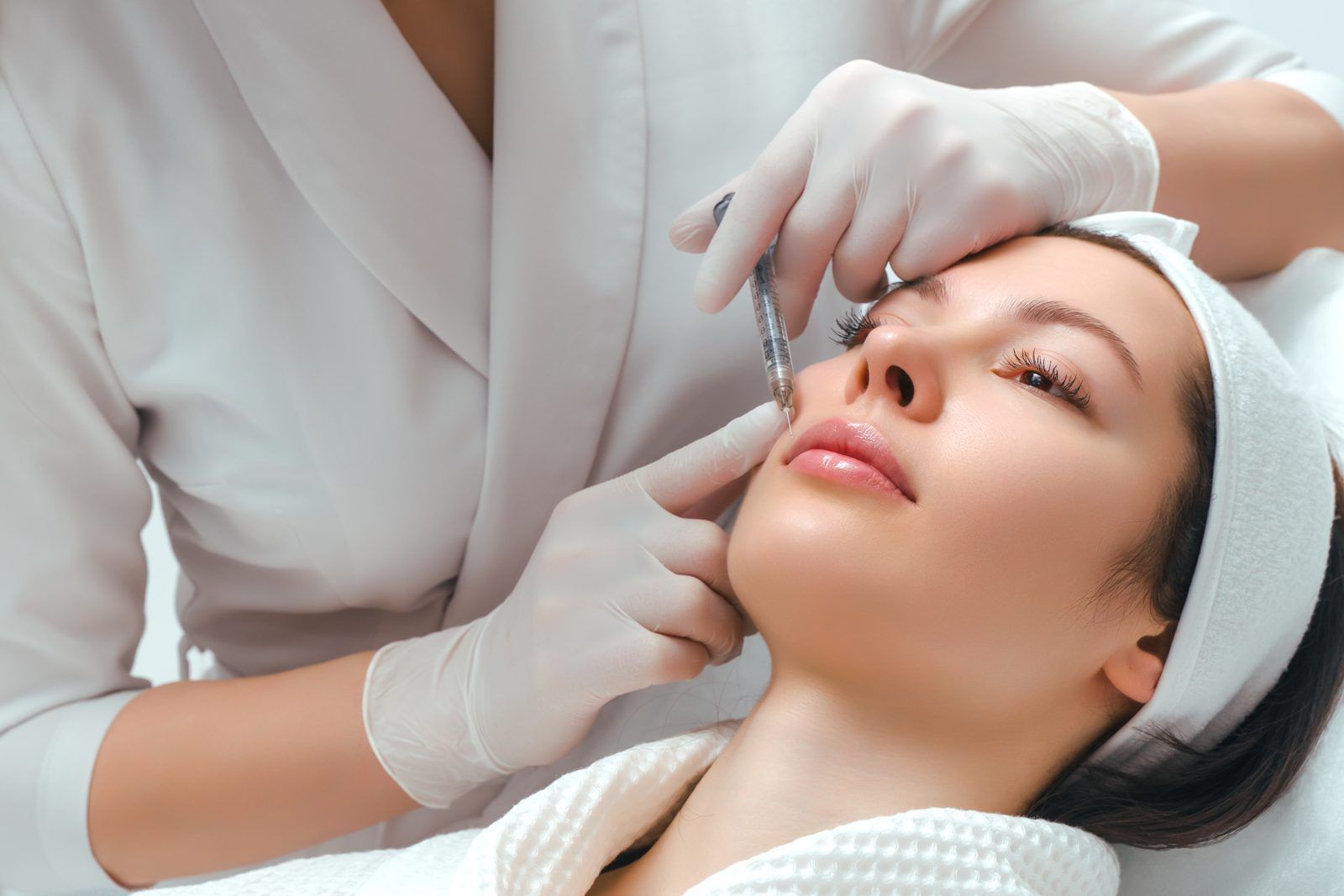 Provider performing a precise Rejuran micro droplet treatment at REJUV Medical