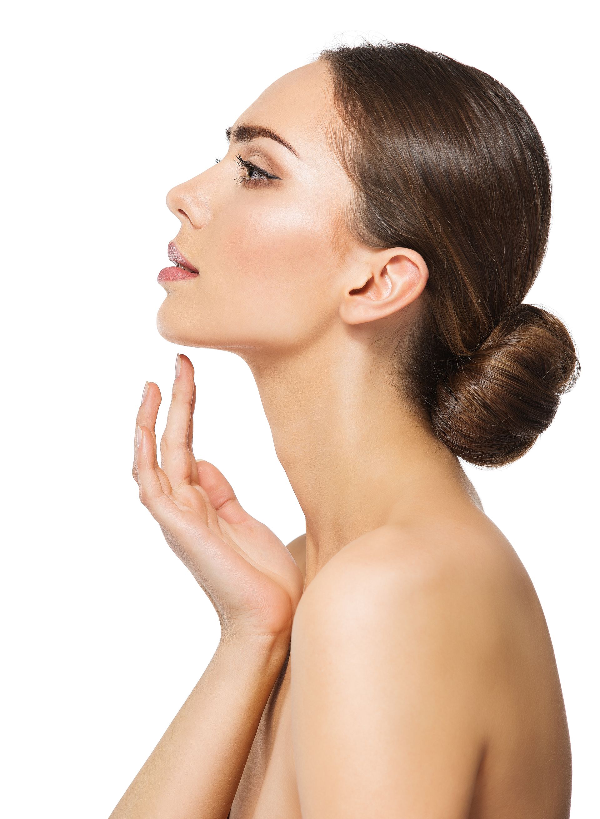 woman with glowing skin touching her neck