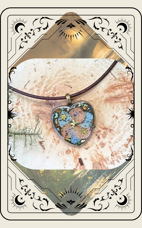 Heart-shaped pendant necklace with colorful accents on a leather cord, set against a textured background.