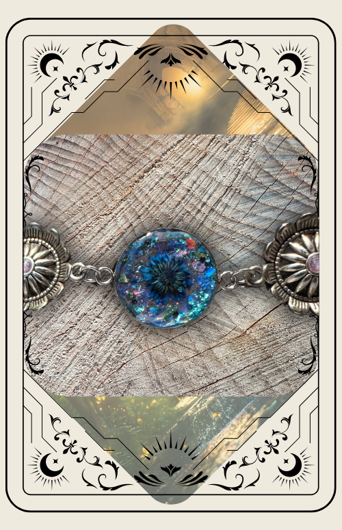 A blue, shimmering resin bead set in a metal chain with western-style floral embellishments against a wood background.